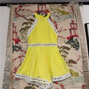 Chic Yellow Sleeveless Romper with Lace Trim